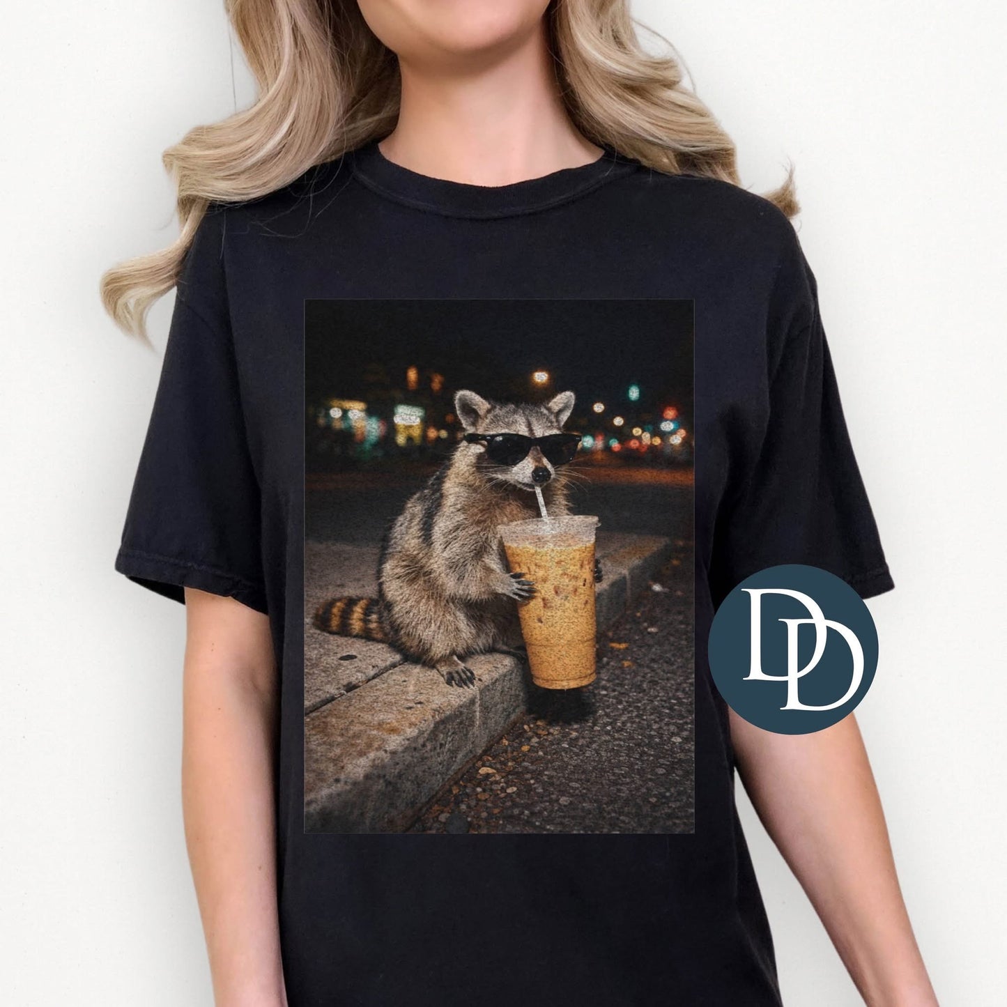 Raccoon drinking coffee
